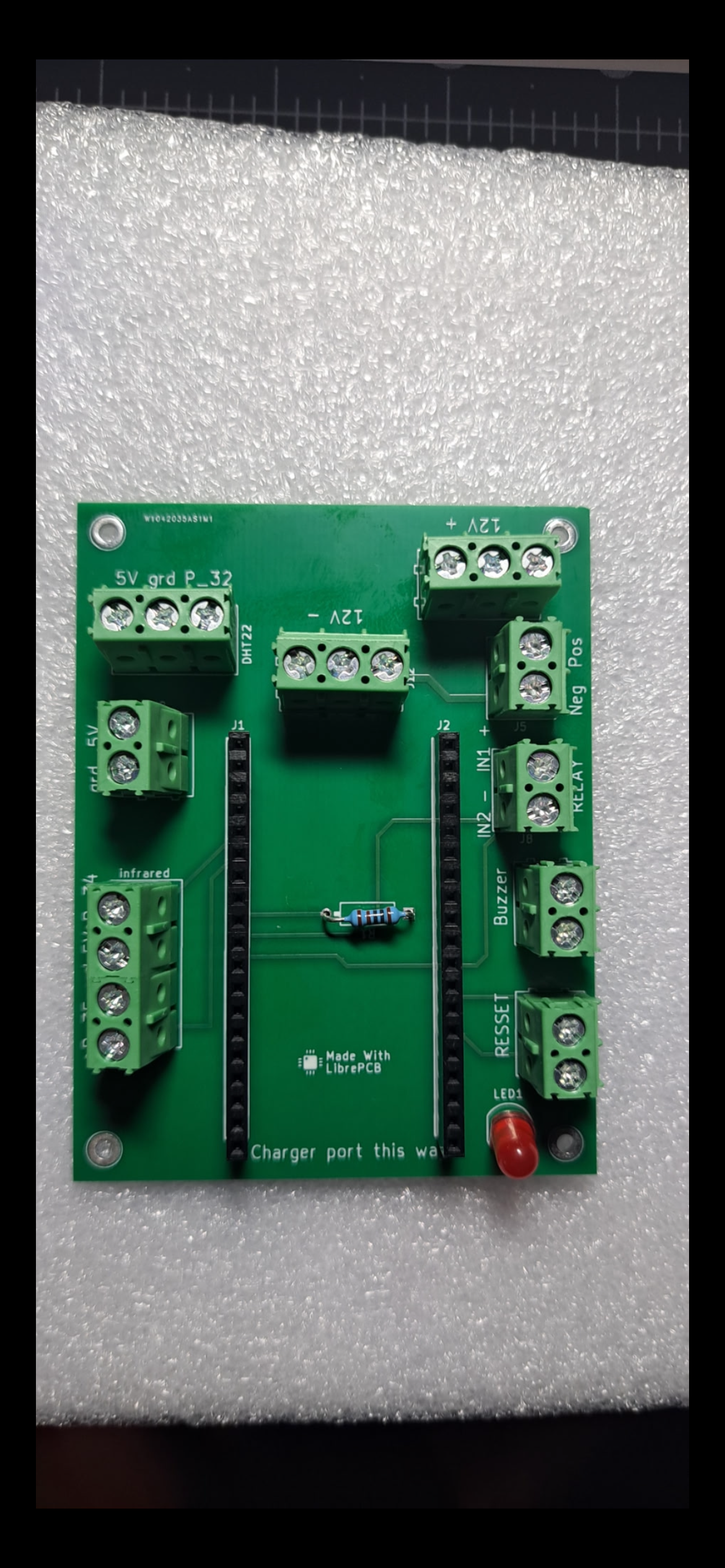 Green circuit board with labeled terminals and sockets for the IoT system